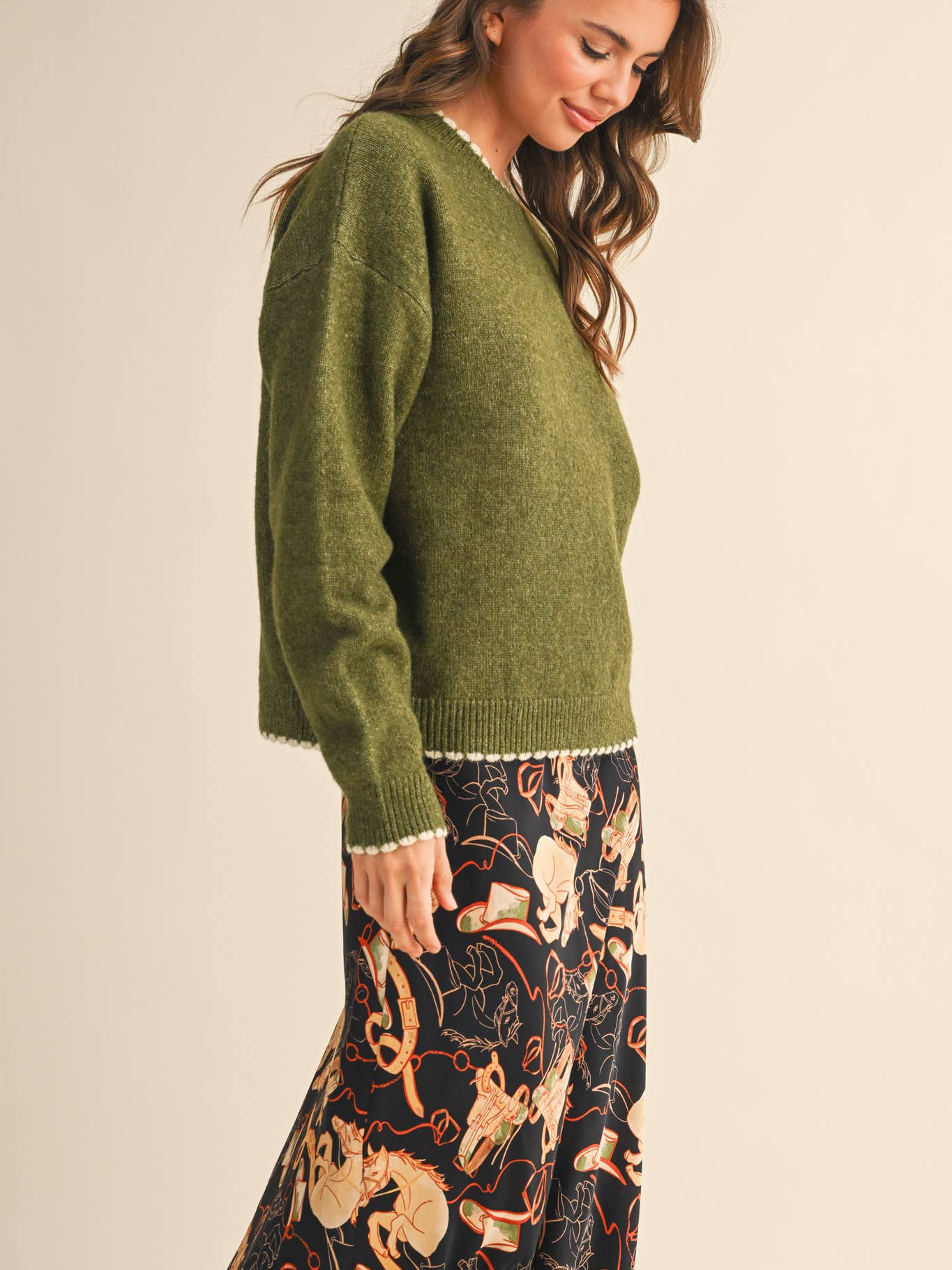 Green scalloped sweater